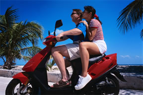 Couple on a motor scooter in Bermuda